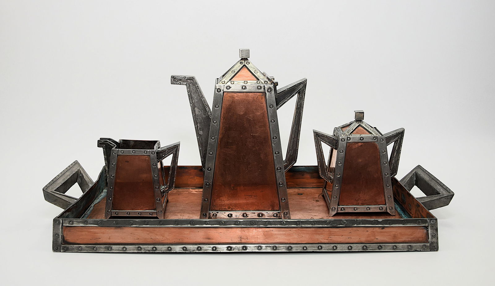 UNIQUE ARTS AND CRAFTS SILVER PLATTED AND COPPER LARGE COFFE SET BY BUCK SILVER Co: UNIQUE ARTS AND CRAFTS SILVER PLATTED AND COPPER LARGE COFFE SET BY BUCK SILVER Co. EXTREMELY RARE FOUR PIECE COFFE SET. Each piece is marked on the bottom " QUADRRUPLE PLATE BUCK SILVER Co. SALAMANKA