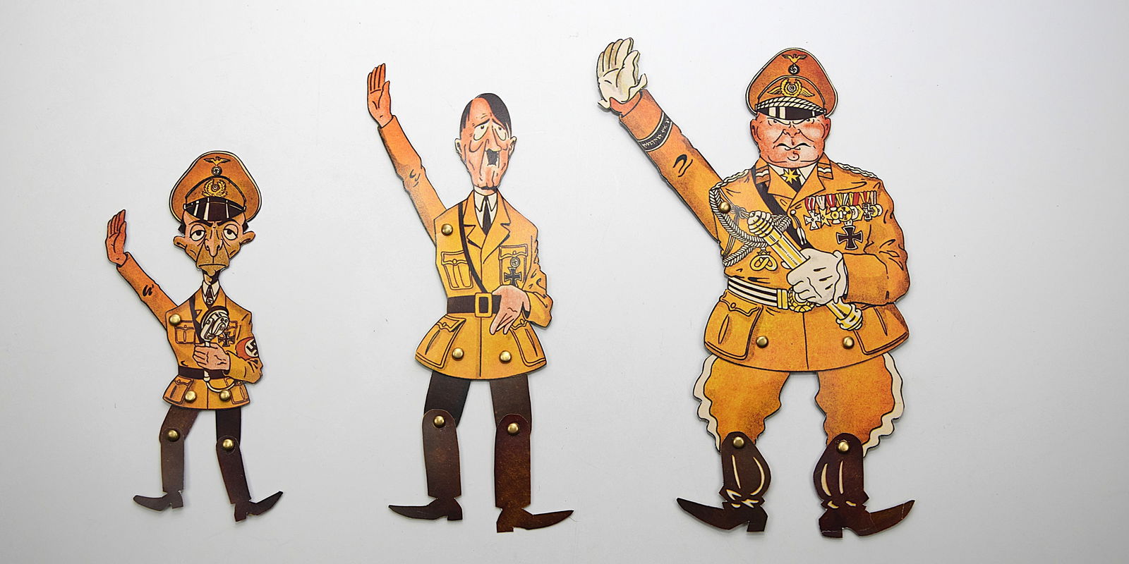 THIRD REICH PROPAGANDA PUPPETS OF HITLER, GORING , GOBBEL C.1940: RARE AND ORIGINAL PROPAGANDA PUPPETS: HITLER, GORING, GOBBELS. Cardboard, color printed, originals around 1940. Size: 1 - 9; 2 - 10; 3 - 11 in. All measurements are approximate. Condition: Please see