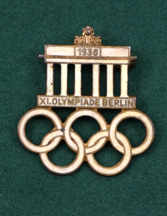 ORIGINAL THIRD REICH 1936 BERLIN OLYMPIC COMMEMORATIVE PIN: ORIGINAL THIRD REICH 1936 BERLIN OLYMPIC COMMEMORATIVE Pin. Stamped on the back "GES GESOH". Awarded to participants and contributors of the 1936 Olympic Games. Size: diameter 1 1/4 x 1 1/8 in. All me