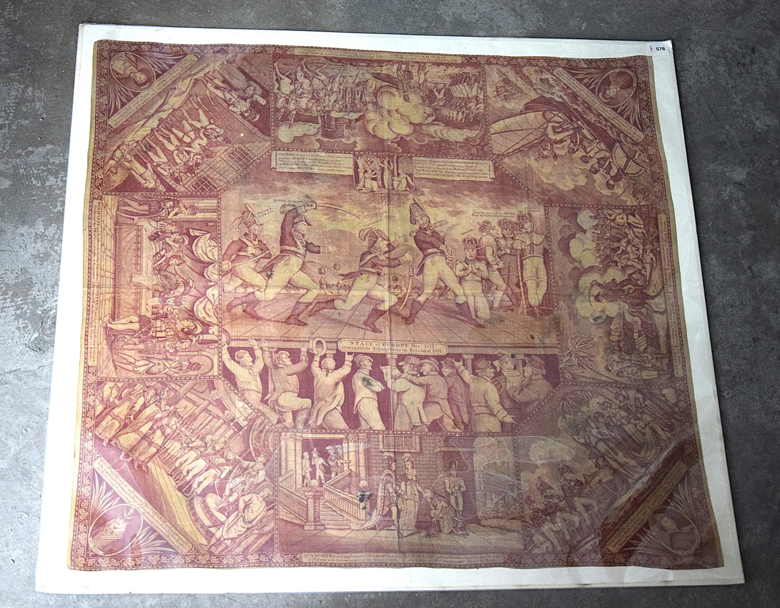 RARE PIECE OF ANTI-NAPOLEON PROPOGANDA COPPERPLATE-PRINTED COTTON HANDKERCHIEF, C.1812: RARE PIECE OF ANTI-NAPOLEON PROPOGANDA COPPERPLATE-PRINTED COTTON HANDKERCHIEF, C.1812. Titled : "Stage of Europe December 1812". Produced in England. Size: 33x 30 in. overall. All measurements are ap