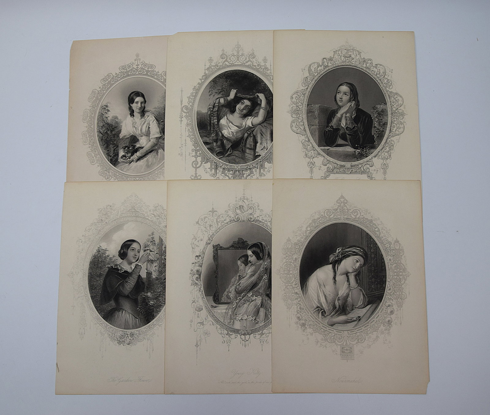 GROUP OF 5 VICTORIAN STEEL ENGRAVED PORTRAIT PRINTS OF WOMEN: A COLLECTION OF FIVE 19TH CENTURY STEEL ENGRAVINGS DEPICTING FEMALE PORTRAITS IN ORNATE OVAL CARTOUCHES, INCLUDING TITLED EXAMPLES SUCH AS “THE EVENING STAR,” “THE INDIAN MAID,” “ANN