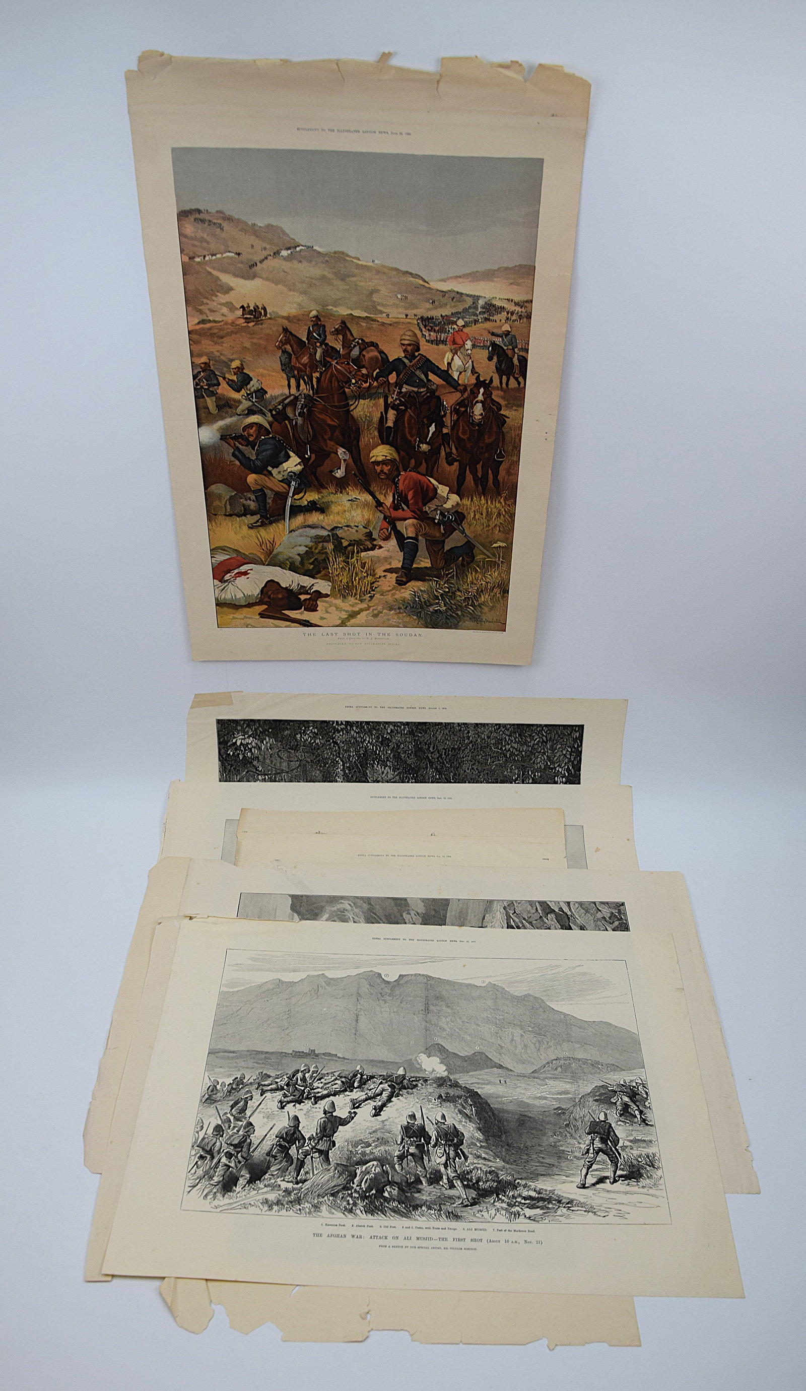 LOT OF SIX 19TH CENTURY ILLUSTRATED LONDON NEWS MILITARY ENGRAVINGS – SOUDAN, AFGHAN & ASHANTEE: A COLLECTION OF SIX 19TH-CENTURY ENGRAVINGS AND COLOR PLATES FROM THE ILLUSTRATED LONDON NEWS, FEATURING “THE LAST SHOT IN THE SOUDAN,” A DRAMATIC COLOR MILITARY SCENE WITH CAVALRY AND INFANTR