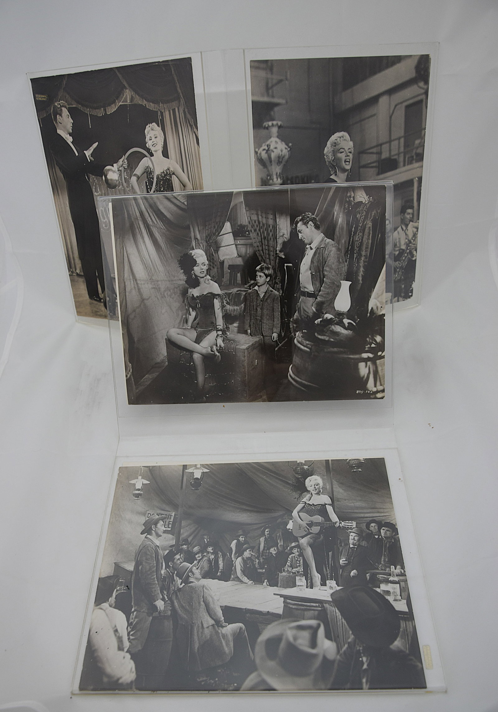 COLLECTION OF MGM MARILYN MONROE STILLS BLACK & WHITE PHOTOGRAPHS MID-20TH CENTURY: GROUPING OF ORIGINAL MARILYN MONROE BLACK-AND-WHITE MGM PICTORIAL PREVIEW AND STILL PHOTOGRAPHS FROM THE FILM “LILI”, FEATURING VARIOUS SCENES AND CHARACTER PORTRAITS. THE COLLECTION INCLUDES 
