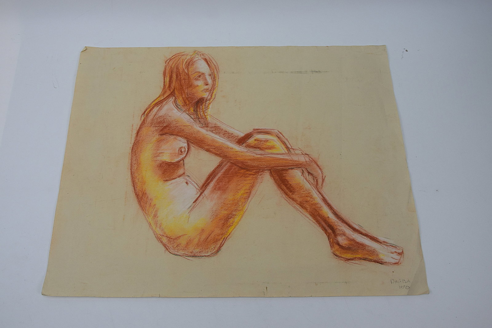 EXPRESSIVE FIGURAL NUDE DRAWING SIGNED BAIBA 1996 CONTEMPORARY STUDY: STRIKING ORIGINAL FIGURAL STUDY DEPICTING A SEATED FEMALE NUDE RENDERED IN WARM TONAL MEDIA, SIGNED “BAIBA” AND DATED 1996 LOWER RIGHT; EXECUTED WITH CONFIDENT, FLUID LINEWORK AND SUBTLE SHADI
