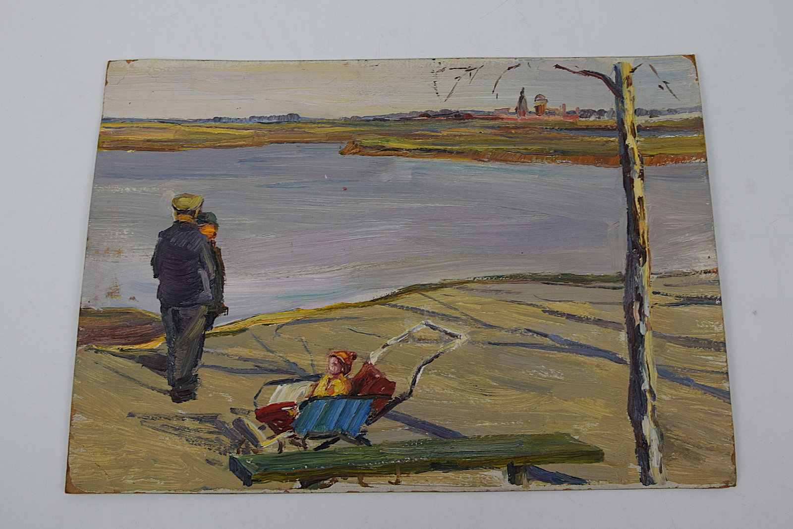 ORIGINAL OIL PAINTING FIGURAL RIVERSIDE SCENE DATED 1968 (RUSSIAN SCHOOL): ORIGINAL MID-20TH CENTURY OIL ON BOARD, DEPICTING A QUIET RIVERSIDE LANDSCAPE WITH FIGURES: AN ADULT WALKING WITH A CHILD ALONG THE BANK AND A BABY IN A PRAM IN THE FOREGROUND; A CALM BODY OF WATER EX