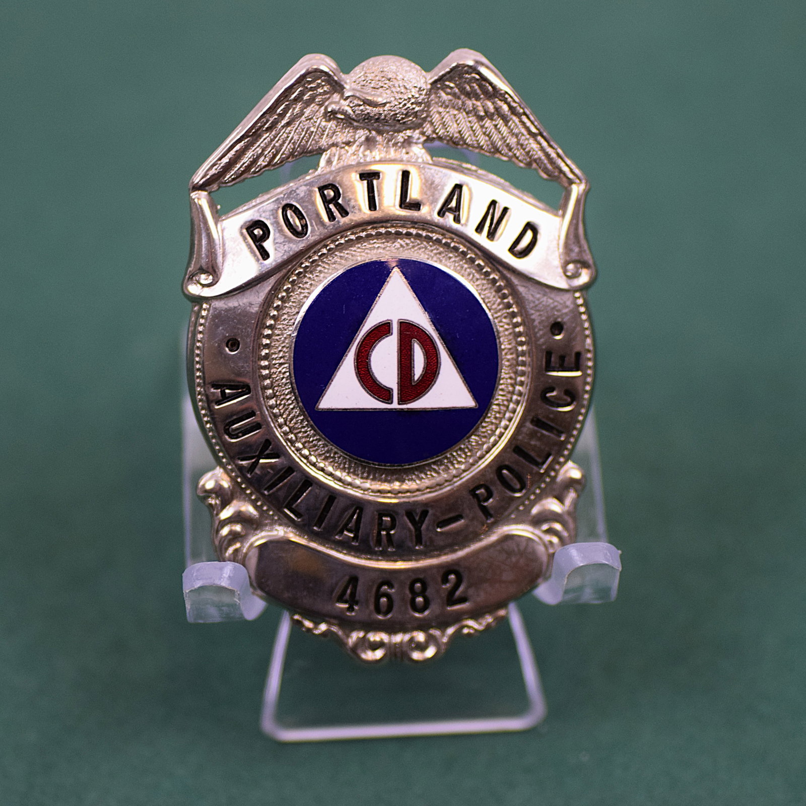 OBSOLITE PORTLAND AUXILIARY POLICE BADGE: OBSOLITE PORTLAND AUXILIARY POLICE BADGE. Number: 4682. Size: 2 1/2 X 2 3/4 in. All measurements are approximate. Condition: Please see pictures. Provenance: NY State prominent military collector. Not