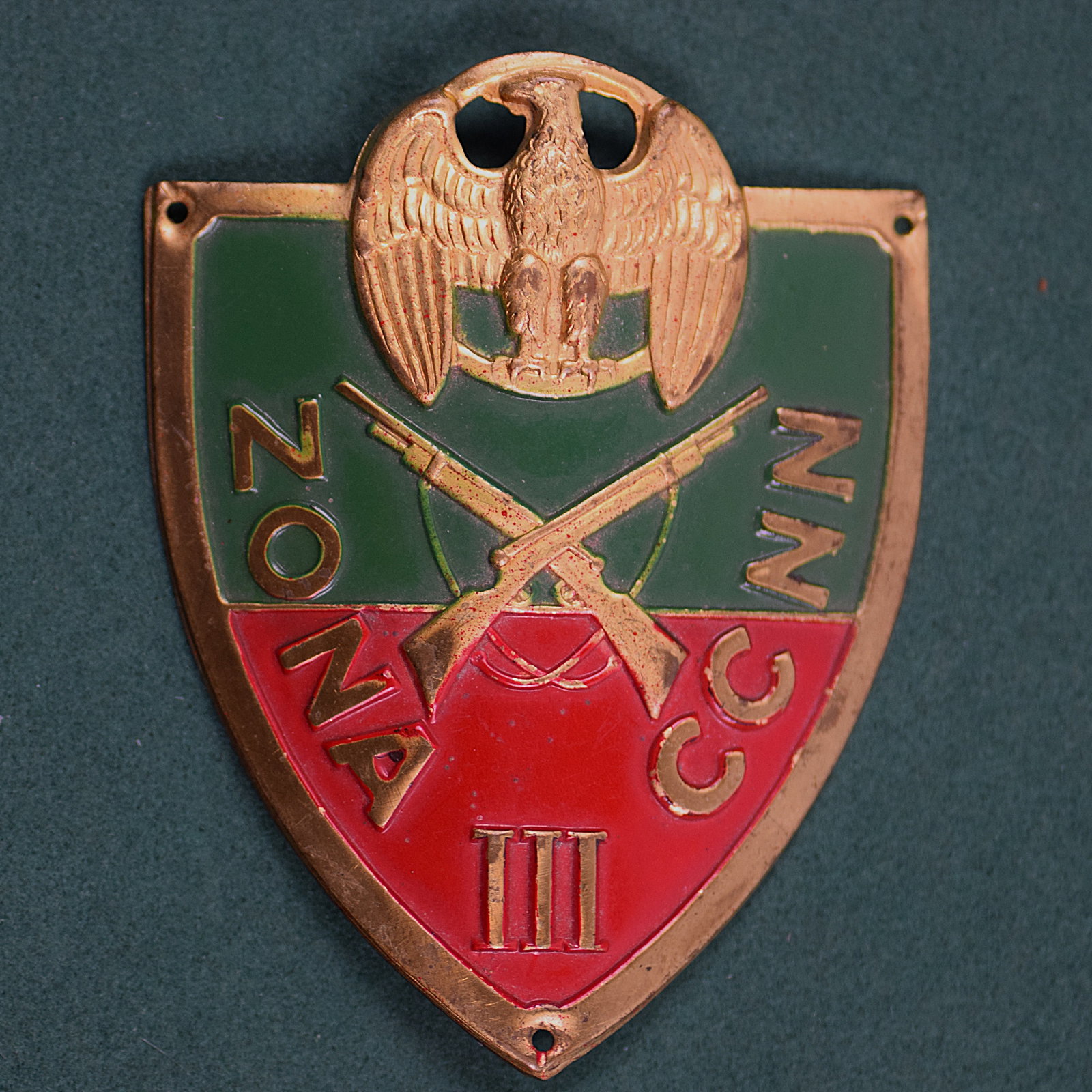 WWII ITALIAN FASCIST CCNN ZONE SHIELD: WWII ITALIAN FASCIST CCNN ZONE SHIELD. Brass badge in the shape of a shield with a sword in the center below and spread eagle. ZONA CCNN III. ZONA CCNN known as the Blackshirts were fascist paramilita