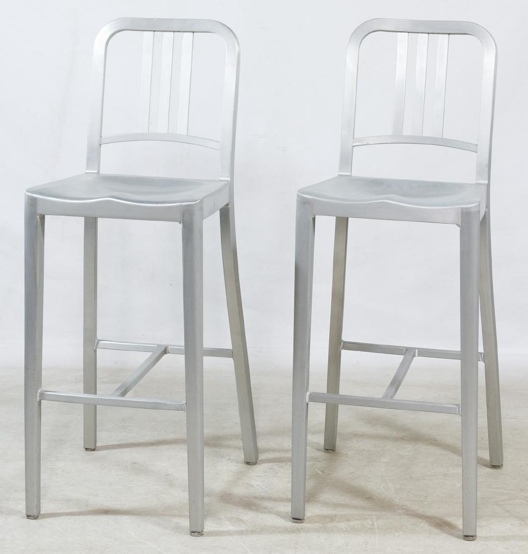 Brushed Aluminum Bar Stools by Emeco: Brushed Aluminum Bar Stools by Emeco Matching pair of Emeco #1006 Navy stools Height: 43.00 inches, Width: 15.75 inches, Depth: 19.50 inches Category: Furniture > Mid-Century Modern Shipping Status: D