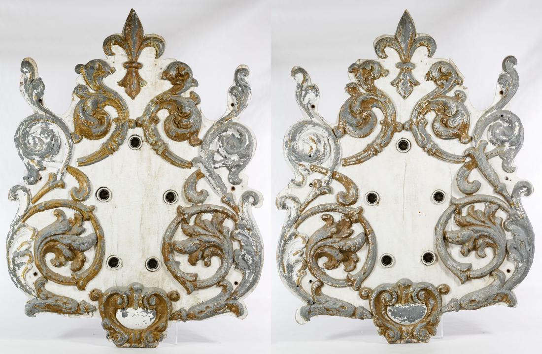 Lighted Carousel Panels: Lighted Carousel Panels Having painted metal Rococo style scrolls applied to wooden panels with five ceramic light sockets each Height: 36.00 inches, Width: 27.00 inches, Depth: 4.00 inches Category: 