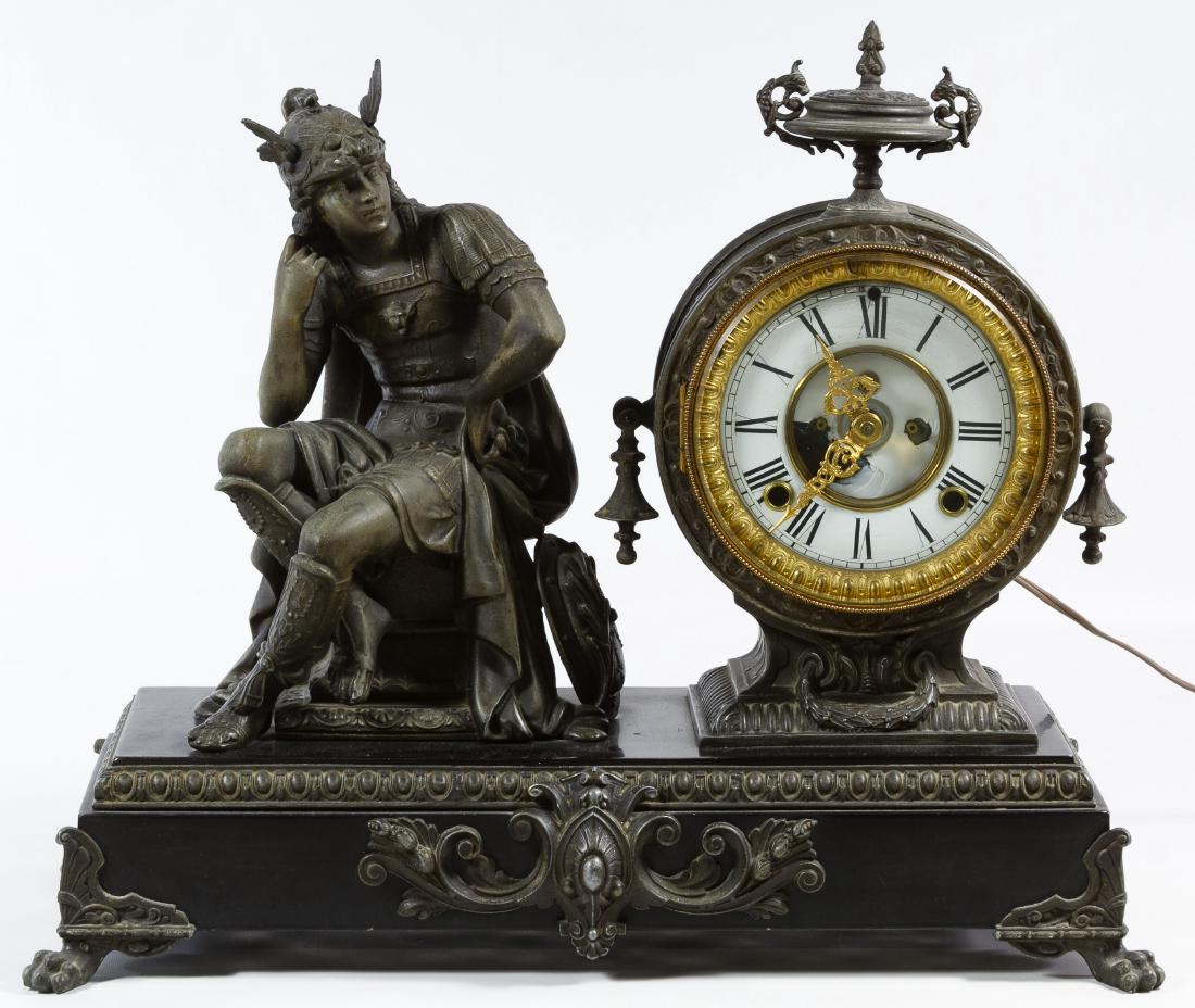 Electrified Spelter Figural Mantel Clock: Electrified Spelter Figural Mantel Clock Having a seated bronze style Roman soldier figure, a metal clock face and a Sessions electric movement Height: 15.00 inches, Width: 17.50 inches, Depth: 7.50 i