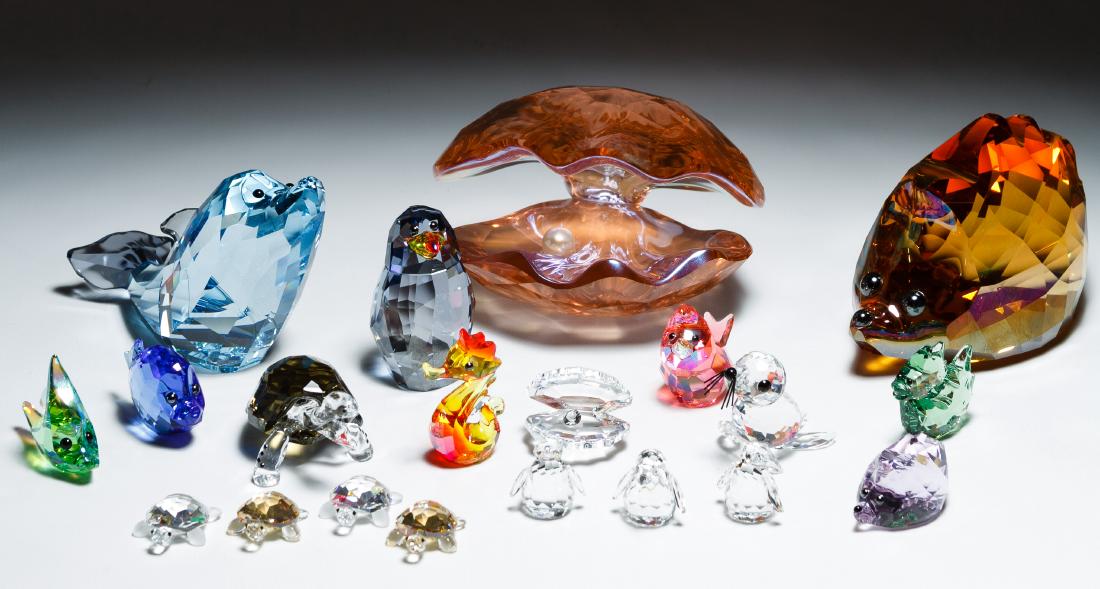 Swarovski Crystal Figurine Assortment: Swarovski Crystal Figurine Assortment Aquatic including clam shell, penguins, turtles, fish and seals; together with two Swarovski hedgehogs and Swarovski style pink clam shell; all marked on bottom H