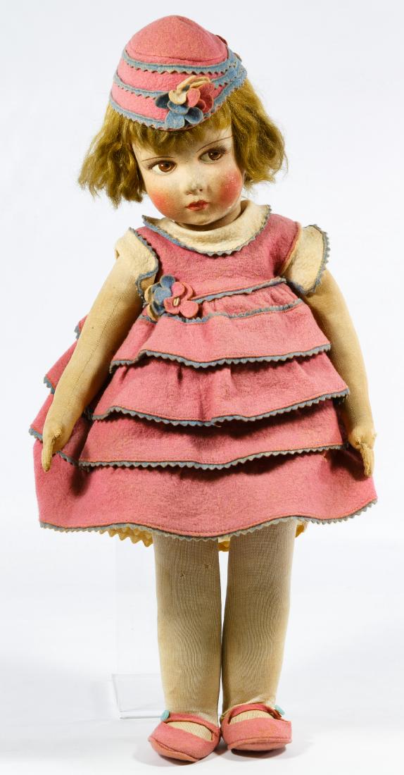 Lenci Type Painted Felt Doll: Lenci Type Painted Felt Doll Having a molded and painted felt head with swivel neck, no ears, a cloth body jointed at the shoulder and hips and original felt dress, shoes and hat Height: 18.00 inches