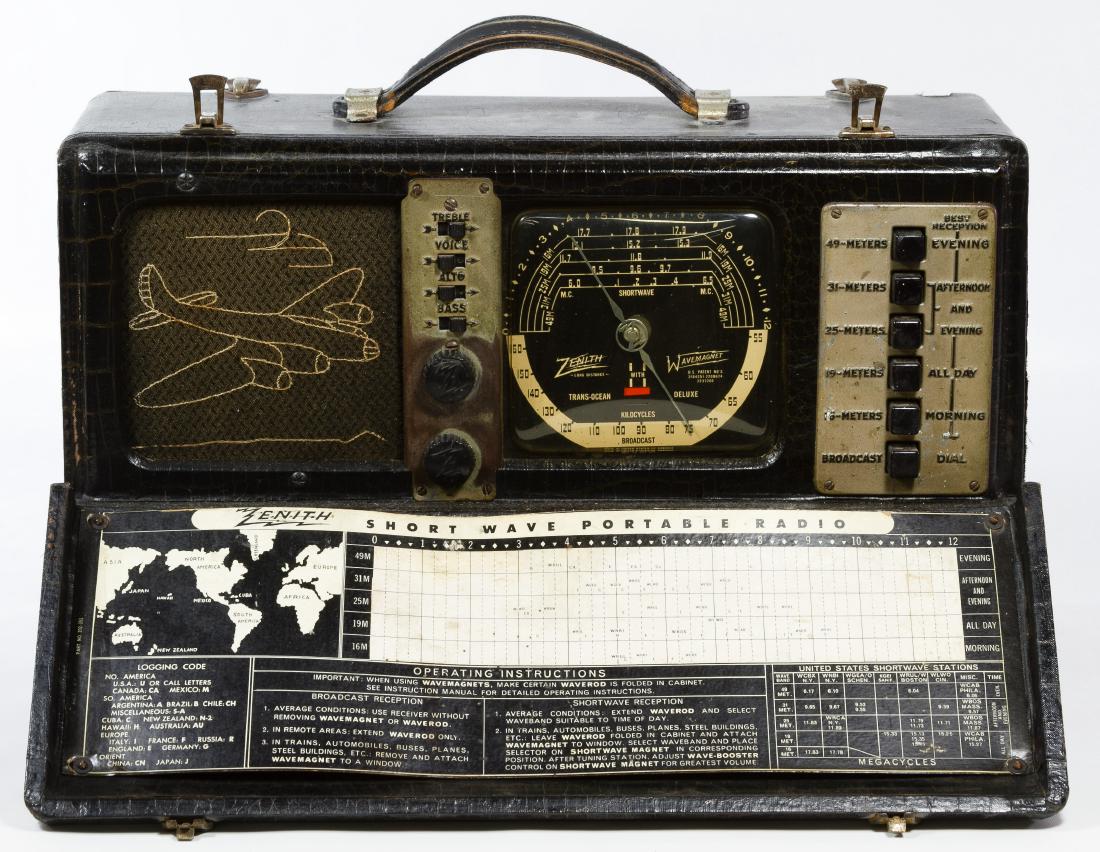 Zenith Wave Magnet Bomber Radio Model 7G605: Zenith Wave Magnet Bomber Radio Model 7G605 Having a portable case, operating instructions, bomber airplane image on the sound grill and the short wave antenna Height: 10.00 inches, Length: 16.50 inch