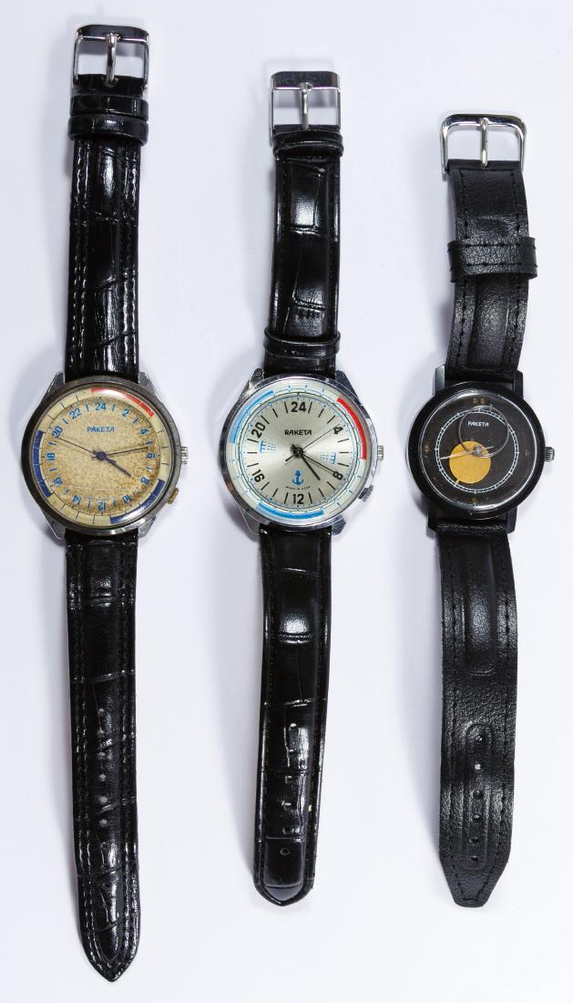 Soviet Russian Raketa Paketa Wrist Watches: Soviet Russian Raketa Paketa Wrist Watches Three wind-up watch items including a Paketa 'Kopernik' style watch #470, a Paketa 24-hour watch #645424 and Raketa 24-hour Navy watch Length: 10.00 inches (