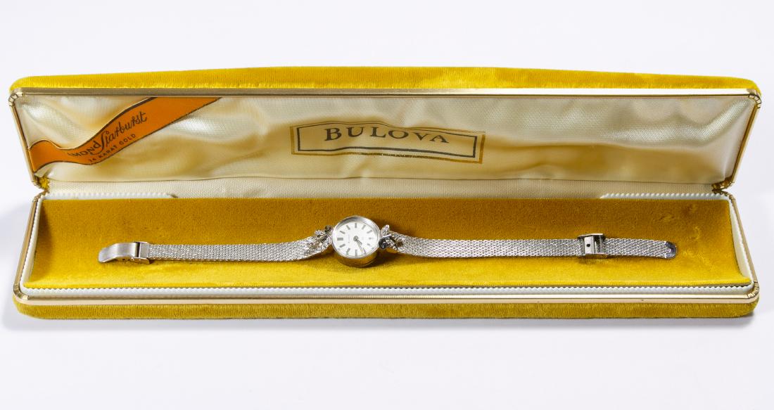 Bulova 14k White Gold Cased Wrist Watch: Bulova 14k White Gold Cased Wrist Watch Adorned with diamond chips on a gold filled band in the original storage case Length: 6.25 inches (adjustable) Category: Watches > Women's Wrist Watches Shippin