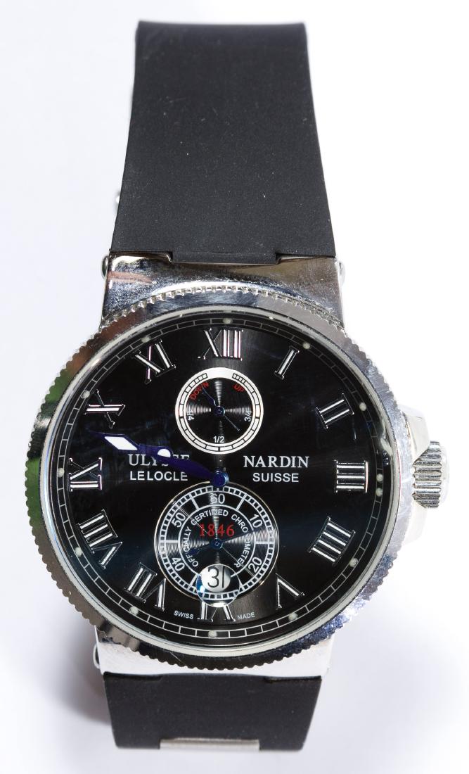 REPLICA Ulysse Nardin 'Marine Chronograph' Men's Wrist: REPLICA Ulysse Nardin 'Marine Chronograph' Men's Wrist Watch Having blue and white arms; ** This is a REPLICA watch ** Length: 4.50 inches Category: Watches > Mixed Lots Shipping Status: Leonard Aucti