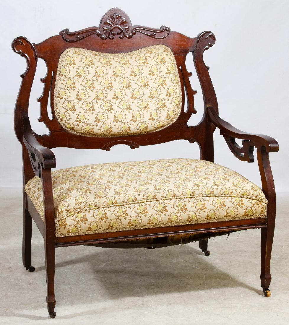 Victorian Mahogany Settee: Victorian Mahogany Settee Having a carved top rail with floral pattern upholstered cushion and back Height: 42.00 inches, Width: 36.00 inches, Depth: 23.00 inches Category: Furniture > American Shippi