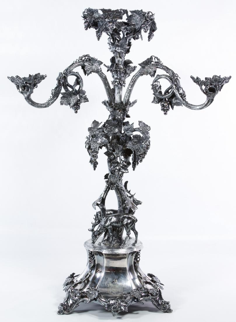 Silverplate 'Virtute Et Opera' Deer and Elk: Silverplate 'Virtute Et Opera' Deer and Elk Candleholder 19th Century, stamped hallmark on the inside of the bottom rim, having a deer and an elk on the base, three candleholders with grape and leaf m