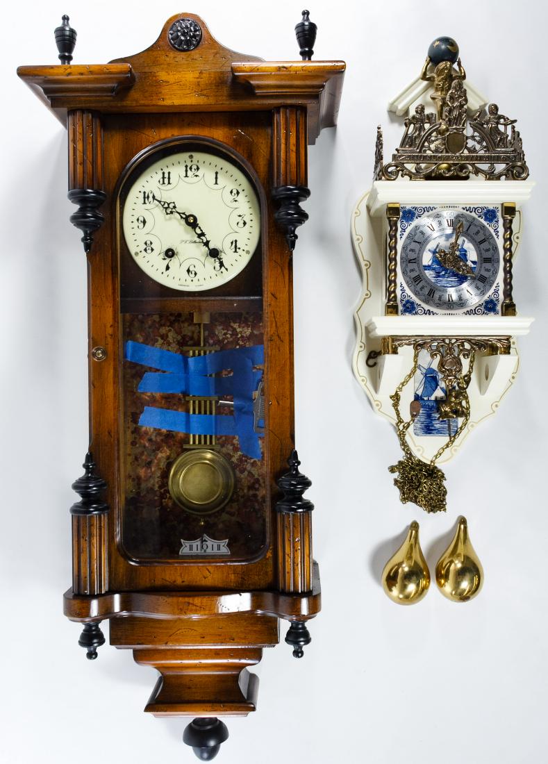 Wall Clocks: Wall Clocks Two items including a walnut P.F. Bollenbach wall clock with porcelain enamelled face, a pendulum and key; and a Franz Hermle 'Atlas' clock #84 Height: 32.00 inches, Width: 13.00 inches, D