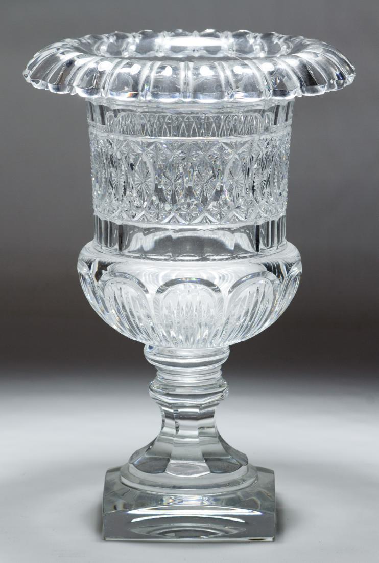 Baccarat Footed Vase: Baccarat Footed Vase Marked 'Baccarat 88/150' on the square base and having a classical urn shape Height: 12.00 inches, Diameter: 8.50 inches Category: Crystal & Glass > Baccarat Shipping Status: Leon
