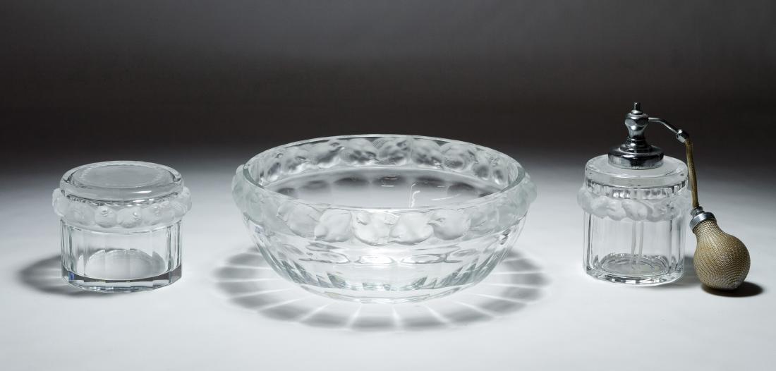 Lalique 'Robinson' Crystal Assortment: Lalique 'Robinson' Crystal Assortment Three items including a perfume atomizer, a lidded jar and a center bowl; all have etched signatures on the undersides Height: 4.00 inches, Diameter: 10.00 inches