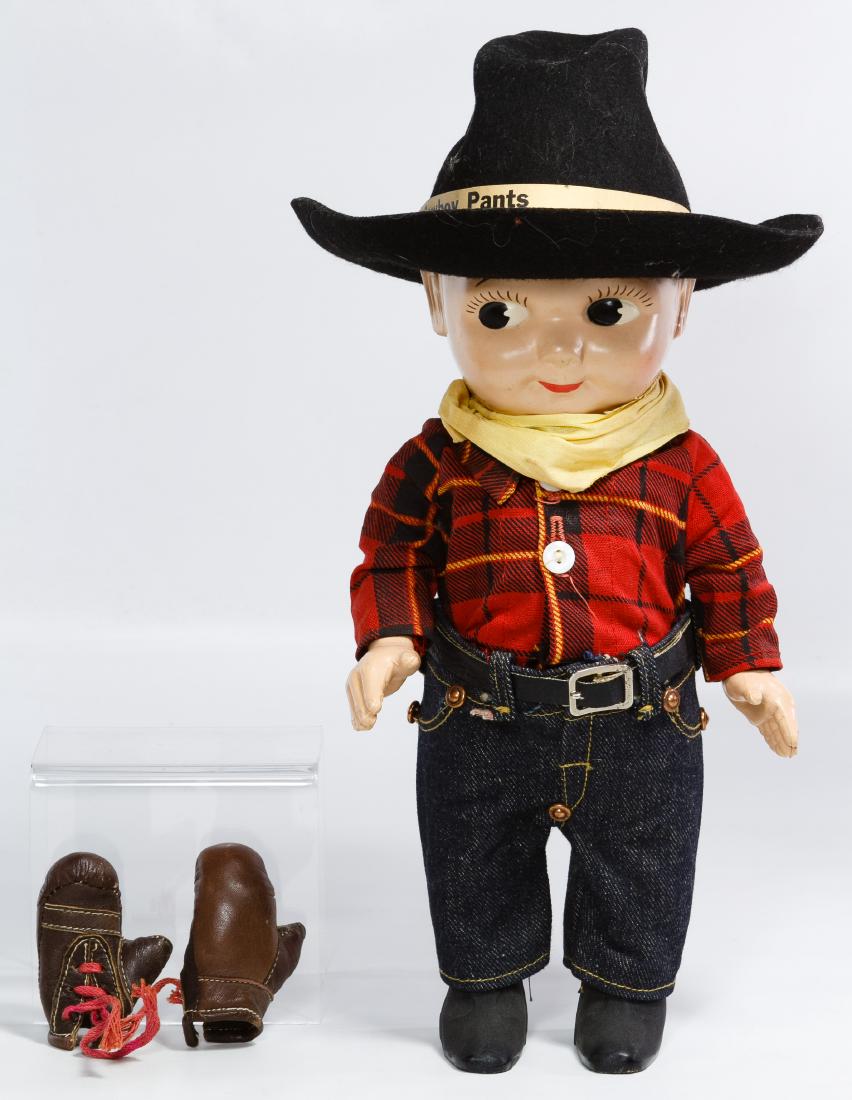 Buddy Lee Hard Plastic Advertising Doll: Buddy Lee Hard Plastic Advertising Doll Having a one piece body, torso and legs with jointed arms and wearing 'Union Made Lee' jeans with plaid shirt, felt cowboy hat with advertising paper band; toge
