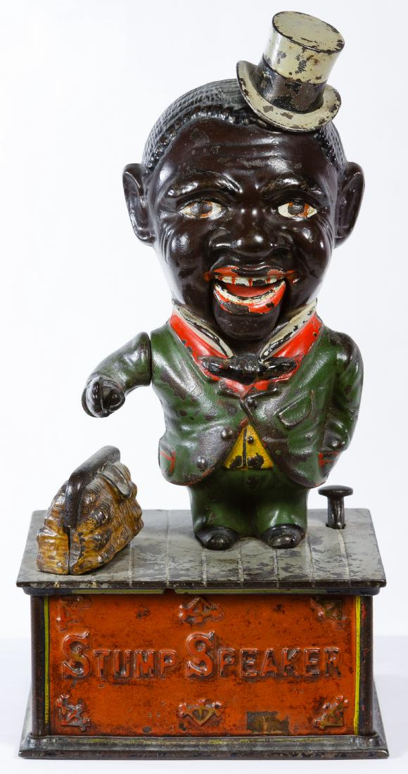 Cast Iron 'Stump Speaker' Mechanical Bank: Cast Iron 'Stump Speaker' Mechanical Bank Having an 1886 patent date and a figure that drops a coin from hand to open bag Height: 10.00 inches, Width: 5.00 inches Category: Collectibles > Toys Shippin