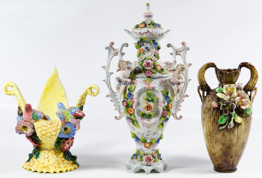 Figural Ceramic Vase Assortment: Figural Ceramic Vase Assortment Three items including an unmarked two handle urn with applied flowers and putti, a vase with ear of corn shaped handles and applied flowers and an Italian marked vase w