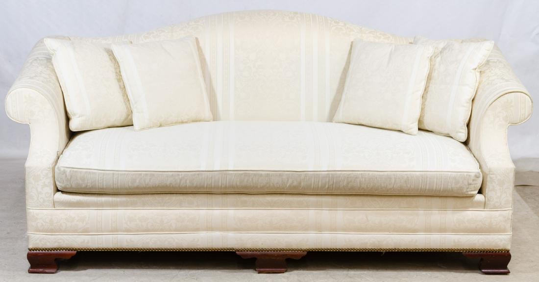 Upholstered Sofa by Kindel: Upholstered Sofa by Kindel Cream colored cushioned sofa with four throw pillows Height: 35.00 inches, Width: 82.00 inches, Depth: 38.00 inches Category: Furniture > Contemporary Shipping Status: Due t