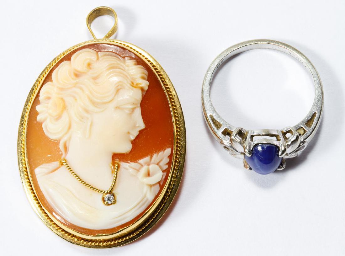 18k Gold Cameo and 14k White Gold, Star Sapphire and: 18k Gold Cameo and 14k White Gold, Star Sapphire and Diamond Ring Including a carved shell cameo pin / pendant of a female wearing a diamond necklace and an oval cut cabochon blue star sapphire flanke