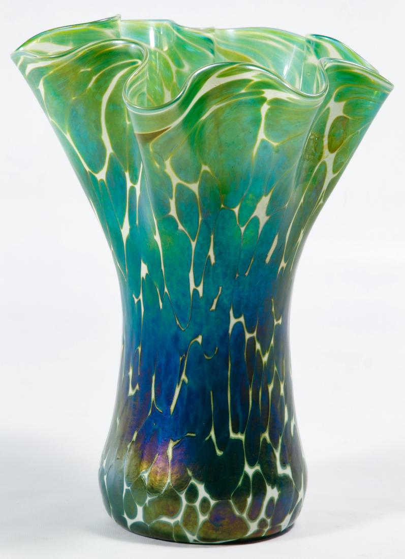 Loetz Style Art Glass Fluted Vase: Loetz Style Art Glass Fluted Vase Unmarked, ruffled edge Height: 9.00 inches Category: Crystal & Glass > Art Glass Shipping Status: Leonard Auction, Inc. will provide direct shipping for this lot.