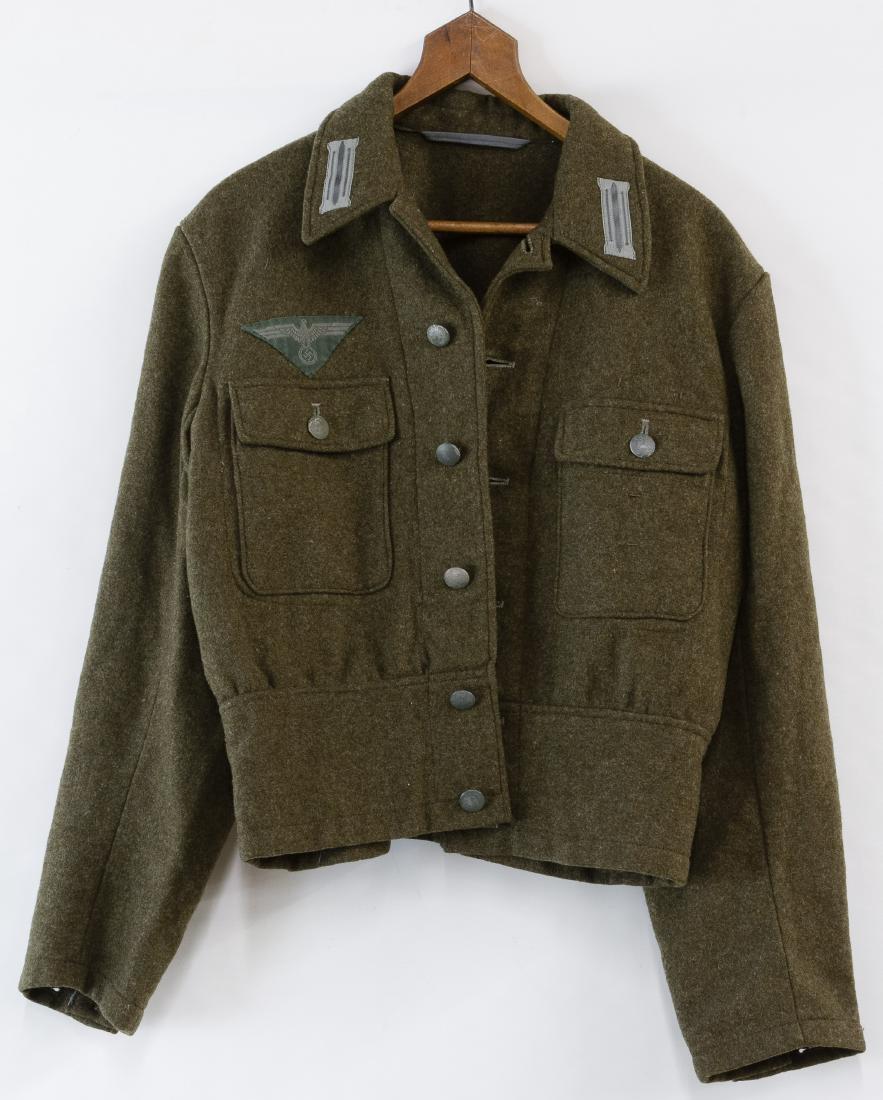 World War II German M44 Tunic: World War II German M44 Tunic Green wool with collar tabs and Nazi eagle patch above the right breast pocket Width: 15.50 inches (22.0) Category: Military & Weapons > World War II Shipping Status: Leo