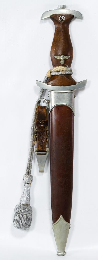 World War II German SA Dagger and Scabbard: World War II German SA Dagger and Scabbard Having a 'J.P. Sauer & Sohn' mark on the blade, attached silver portepee and leather hanger Length: 14.75 inches (includes scabbard) Category: Military & Wea