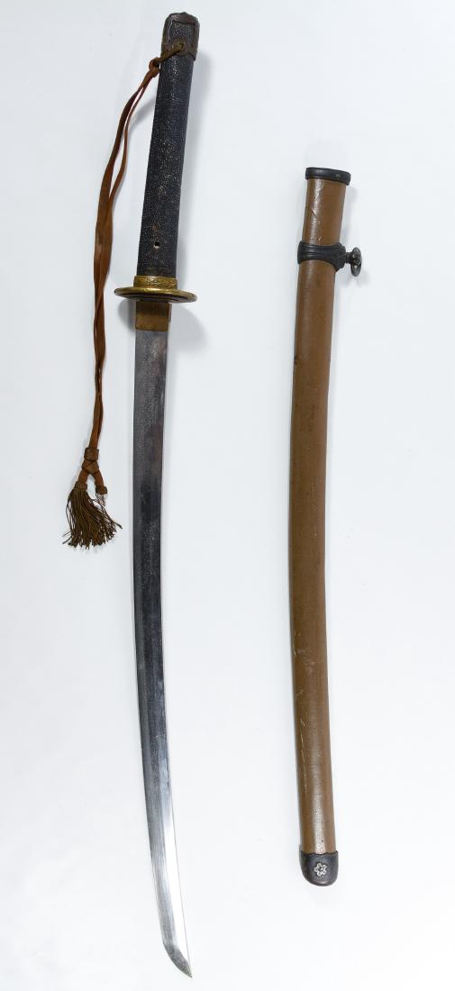 World War II Japanese Katana Sword and Scabbard: World War II Japanese Katana Sword and Scabbard Having etched markings on the tang, a metal blade and metal scabbard Length: 36.50 inches (not including scabbard) Category: Military & Weapons > World 