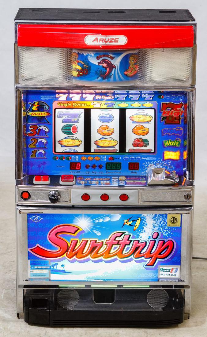 Aruze 'Surftrip' Token Slot Machine: Aruze 'Surftrip' Token Slot Machine Serial #011954, attached label on back; including tokens Height: 32.00 inches, Width: 18.75 inches, Depth: 16.00 inches Category: Cameras & Instruments > Video Game