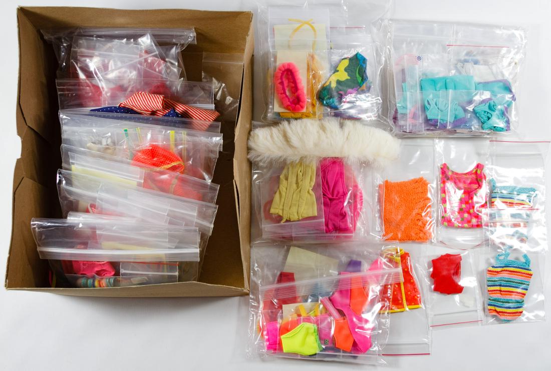Mattel Barbie Swimsuit, Dress and Shoe Assortment: Mattel Barbie Swimsuit, Dress and Shoe Assortment Including Barbie and Skipper tagged swimsuits, a Barbie (R) tagged Gay Parisienne dress #964 with rabbit fur stole, hat and necklace, a pair of #1 Bar