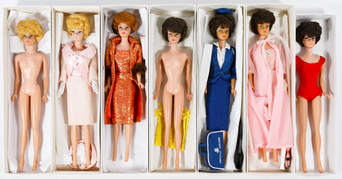Mattel Bubblecut Barbie Doll Assortment: Mattel Bubblecut Barbie Doll Assortment Seven dolls from the 1963 to 1965 era; together with four tagged Barbie outfits and one red swimsuit Height: 11.25 inches (all dolls) Category: Collectibles > D