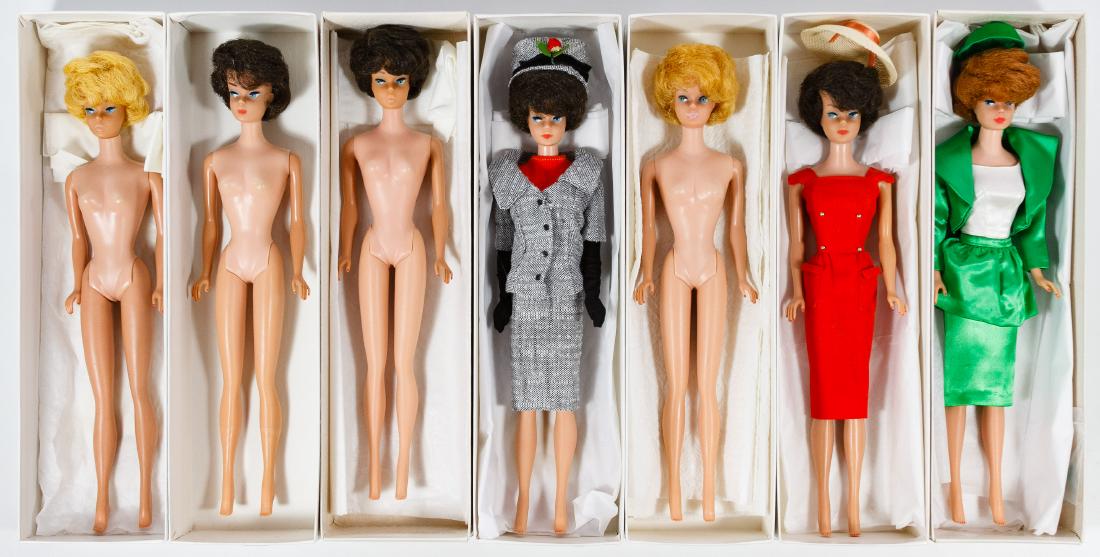 Mattel Bubblecut Barbie Doll Assortment: Mattel Bubblecut Barbie Doll Assortment Seven items from the 1963 to 1965 era including (2) blondes, (4) brunettes and a titian; together with (3) Barbie tagged clothing outfits Height: 11.25 inches C