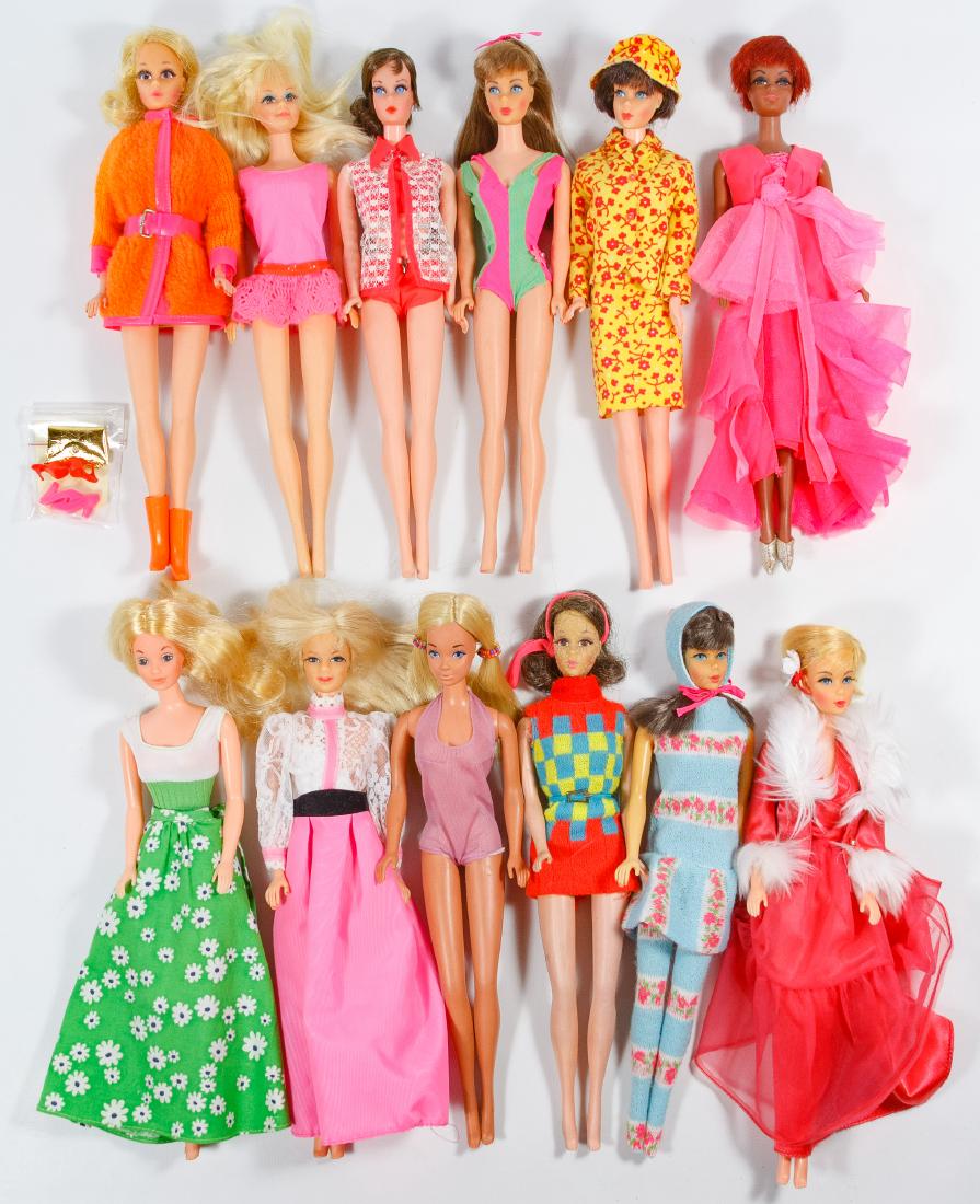 Mattel Mod Dressed Barbie Family Doll Assortment: Mattel Mod Dressed Barbie Family Doll Assortment Including (12) dolls from the 1968 to 1972 era with two in Barbie tagged clothes and one in a Julia tagged dress; together with a small bag of clothing