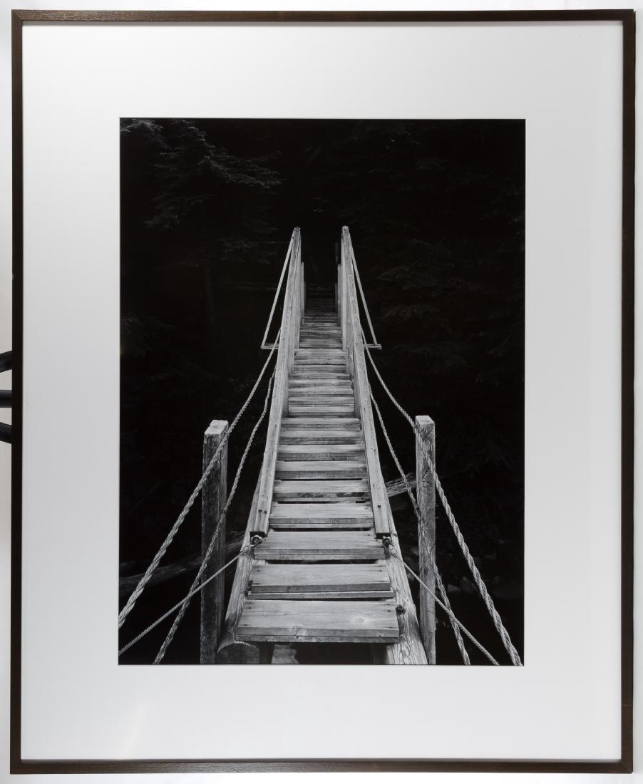 Michael Johnson (American, 20th Century) 'Footbridge': Michael Johnson (American, 20th Century) 'Footbridge' Photograph Undated, possibly signed on back of photograph, black and white photograph of a wood footbridge Height: 29.00 inches, Width: 21.50 inch