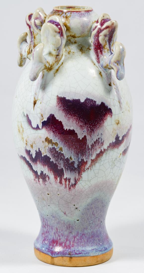 Chinese Flame Ceramic Fish Vase: Chinese Flame Ceramic Fish Vase Purple and white glaze with four fish around the top rim, incised mark on the bottom Height: 9.00 inches Category: Pottery & Porcelain > Asian Shipping Status: Leonard