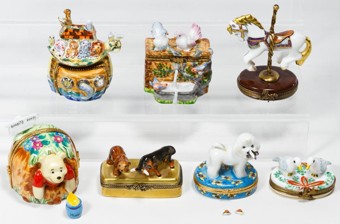 Limoges Trinket Box Assortment: Limoges Trinket Box Assortment Seven Limoges marked items including a Bull and Bear market box, Winnie the Pooh, Two Turtle Doves, a poodle with butterfly, a carousel horse, Noah's arc and birds at a