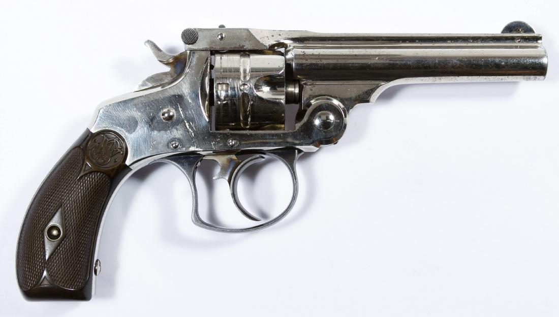 Smith and Wesson .32 S&W Cal. Revolver (Serial #20387): Smith and Wesson .32 S&W Cal. Revolver (Serial #20387) c.1880; including the original box; second model top break five round double action revolver, chrome plated with bakelite grips Length: 3.50 inch