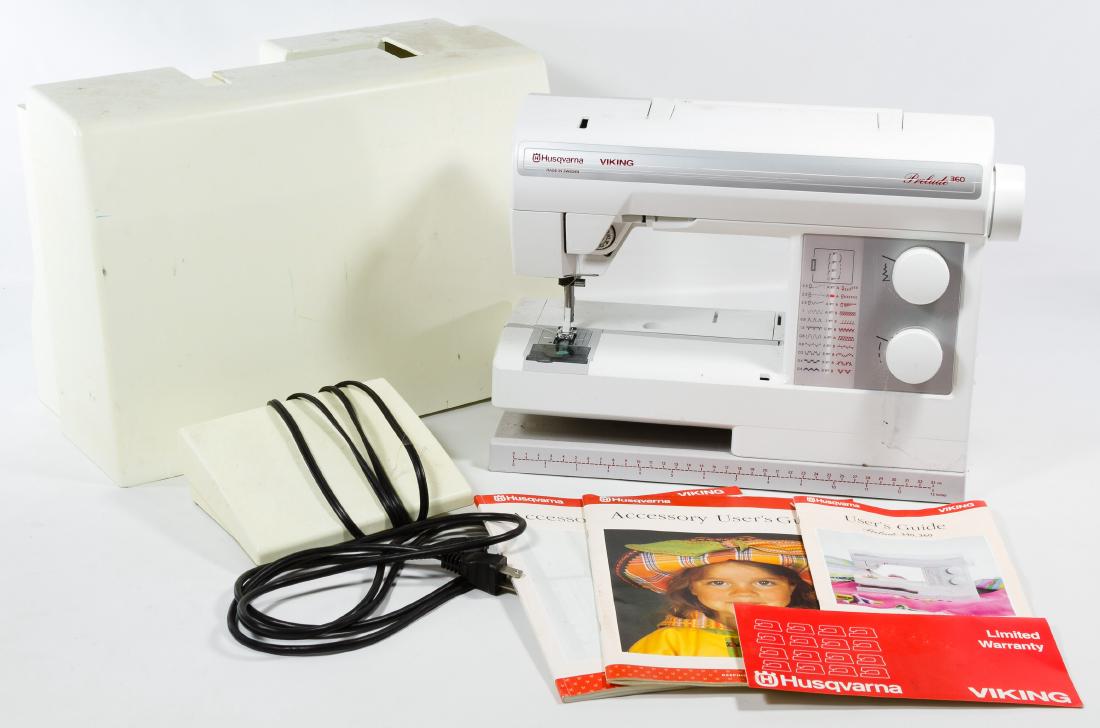 Husqvarna Viking Prelude 360 Sewing Machine: Husqvarna Viking Prelude 360 Sewing Machine Serial #91018893, having white cover and instructions Height: 11.50 inches, Width: 17.00 inches, Depth: 8.50 inches Category: Cameras & Instruments > Sewing