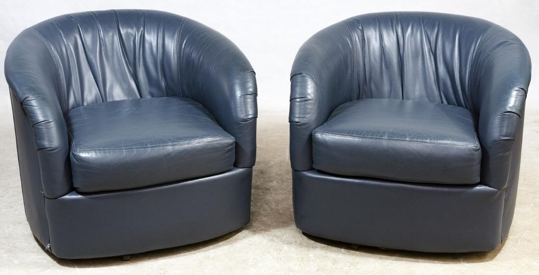MCM Leather Club Chairs (in the style of) Milo Baughman: MCM Leather Club Chairs (in the style of) Milo Baughman Matching pair of gray leather curved back swivel chairs with cushioned seat Height: 27.00 inches, Width: 31.00 inches, Depth: 32.00 inches Categ