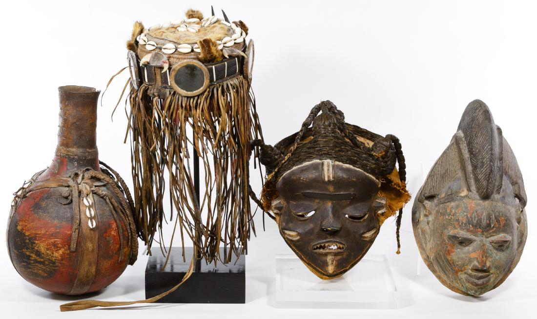 Primitive Mask, Hat and Vessel Assortment: Primitive Mask, Hat and Vessel Assortment Four items including painted wood mask, mask made of wood, horsehair and burlap, a shell, leather and mirror hat and a painted vessel with leather straps; tog