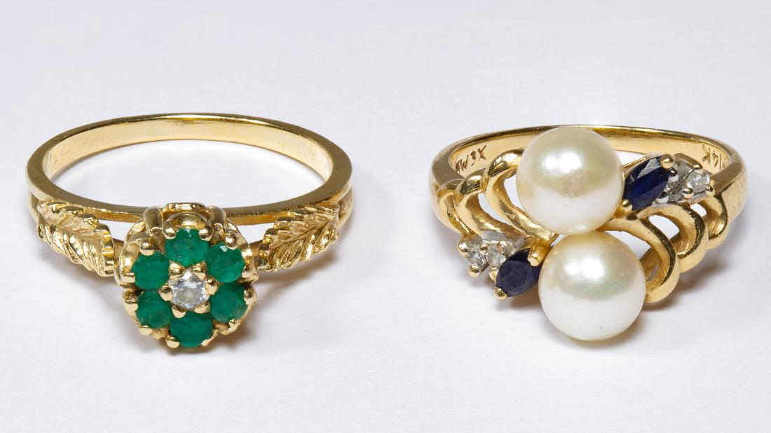 14k Gold and Gemstone Rings: 14k Gold and Gemstone Rings Two rings, one having a central round cut diamond surrounded by round cut emeralds, the other having two 6mm pearls adorned by spinel and diamonds; both marked '14k' inside