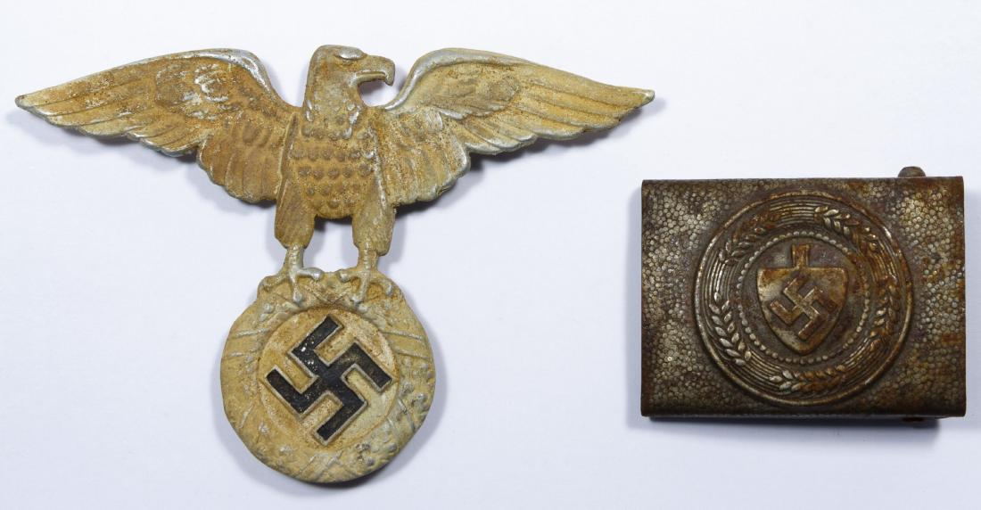 World War II German Belt Buckle: World War II German Belt Buckle Together with a NSKK motorcycle helmet badge Height: 3.50 inches, Width: 5.00 inches (tallest) Category: Military & Weapons > World War II Shipping Status: Leonard Auct