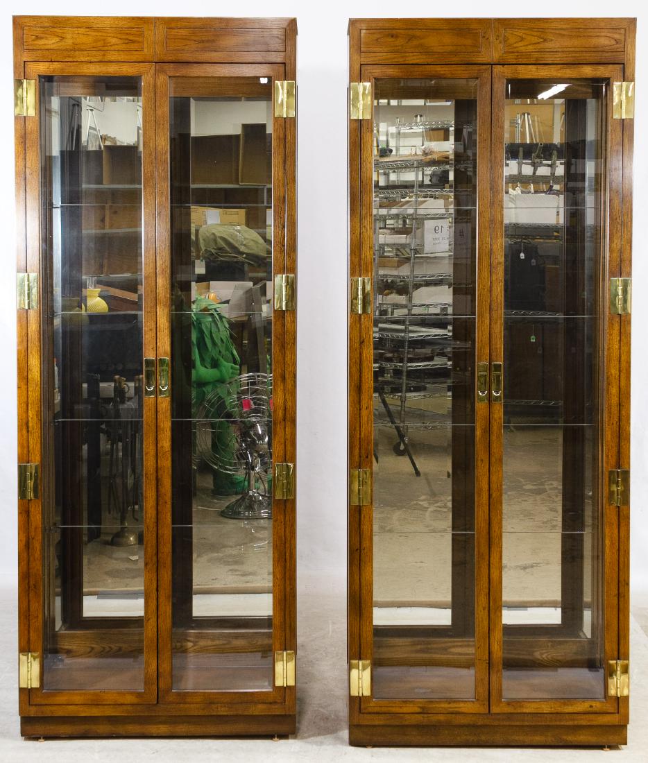 Oak and Glass Display Cabinets by Henredon: Oak and Glass Display Cabinets by Henredon Matching lighted cabinets having double wood framed beveled glass doors and sides, mirrored backs, brass hardware and glass shelves Height: 82.00 inches, Wid
