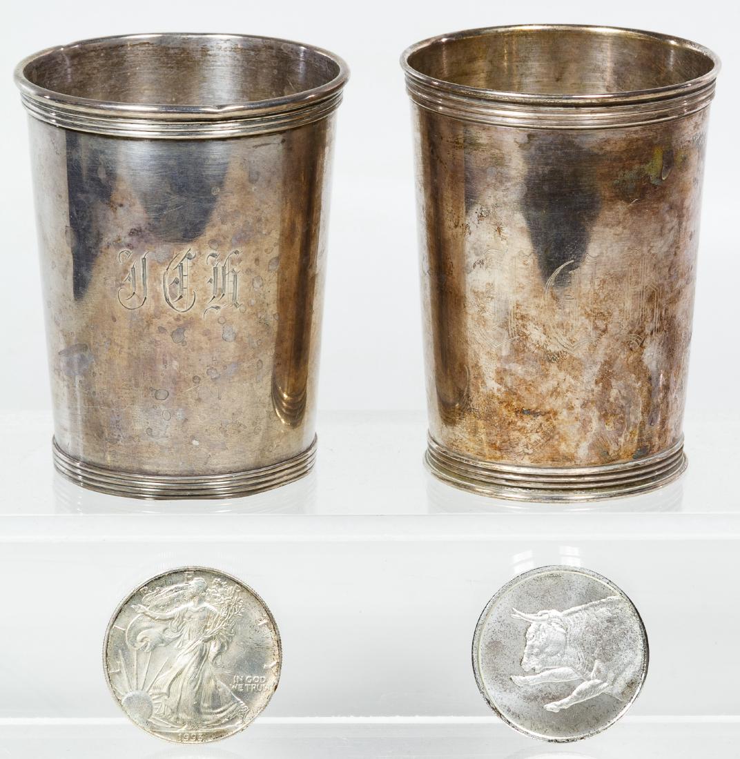 Sterling Silver Julep Cups: Sterling Silver Julep Cups Including (2) engraved sterling silver mint julep cups; together with a 1993 silver eagle and a 'Bull and Bear' market themed one ounce silver round Height: 3.50 inches (cup